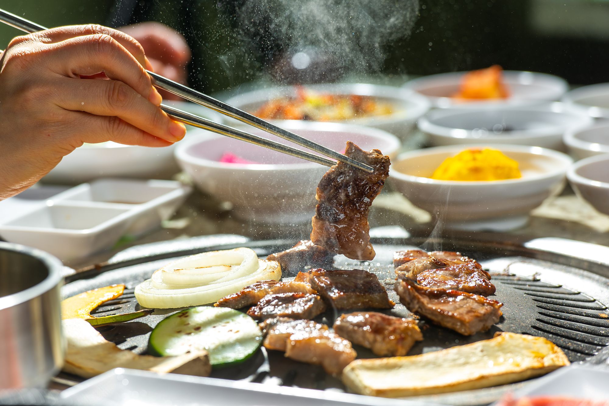 Marinated short rib lifted from a smoking charcoal grill at Lee's Korean BBQ